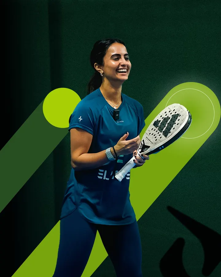 A smiling player holding a racket on court