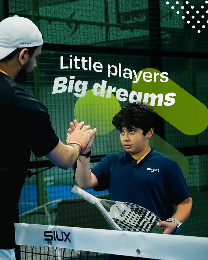 Little players, big dreams: a coach high-fiving a young player